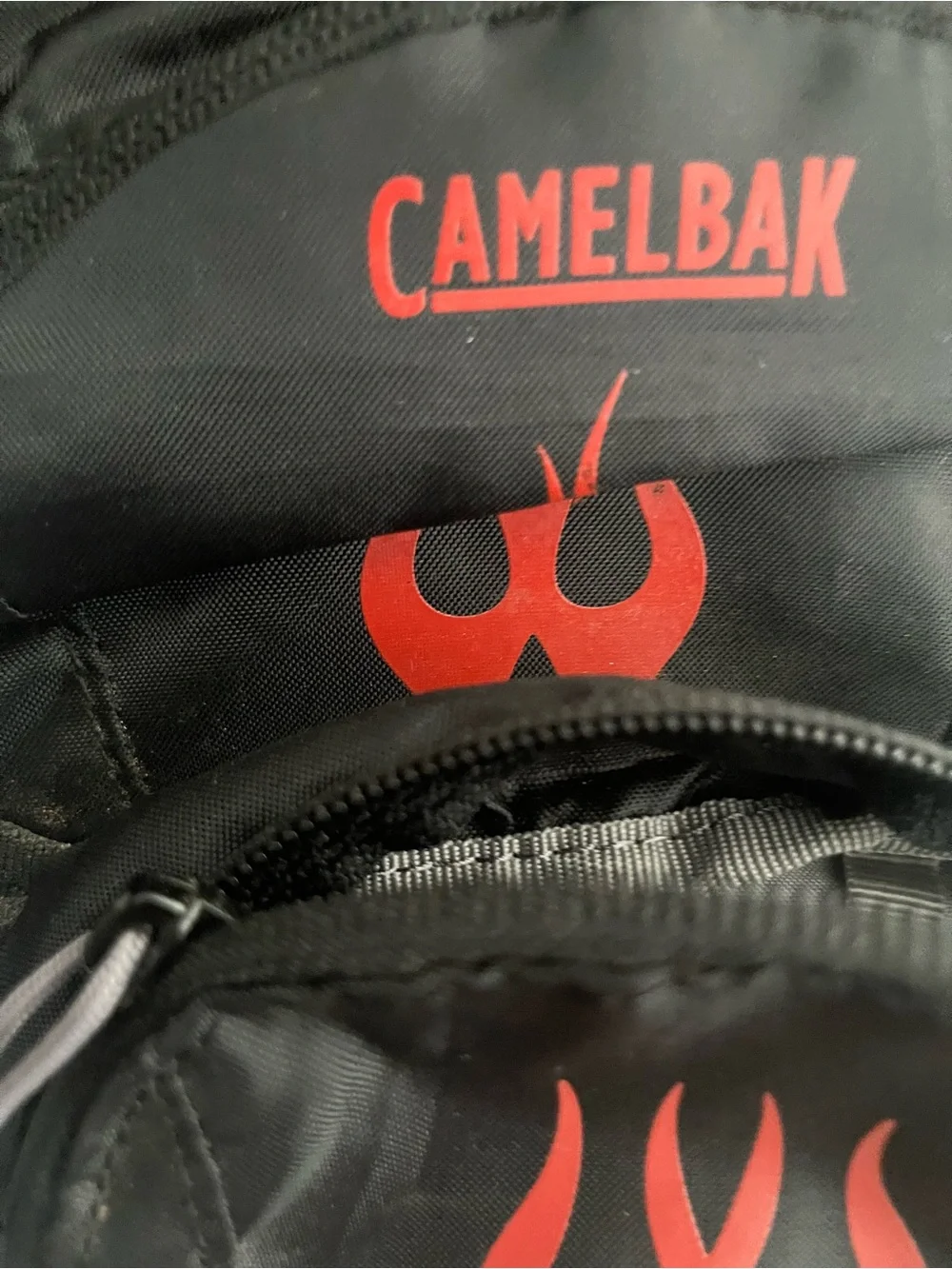 CamelBak Black Backpack with Red Flame Graphic Accent